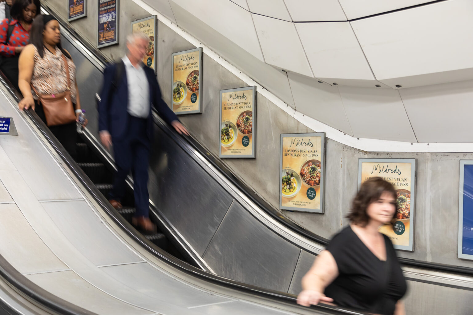 An example of escalator panels advertising on the London Underground.