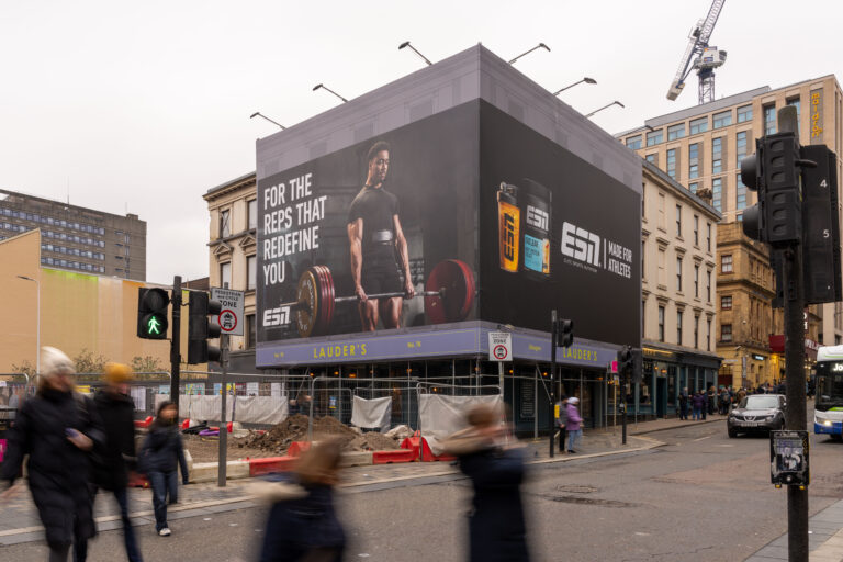 An example of a building wrap in Glasgow featuring protein brand ESN.